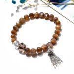 Golden Bone Crystal Bracelet with Tassel Design
