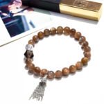 Golden Bone Crystal Bracelet with Tassel Design
